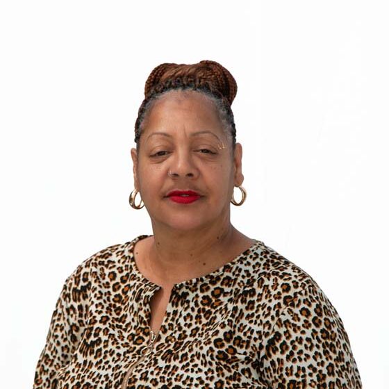 Profile image of Evelyn Smith, an African-American woman with light brown skin and black hair in a high bun.