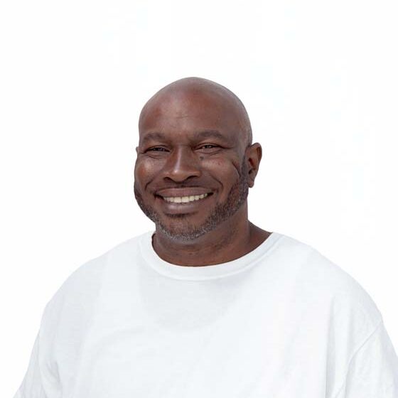 Profile image of Jackson Ray, a Black man with dark stubble and a shaved head.