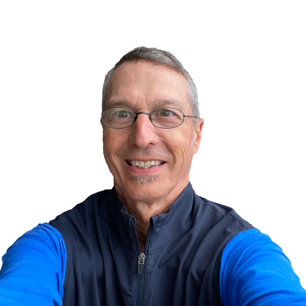 Profile image of Baxter Bell, a white man with short graying hair and a small grey "soul patch" wearing oval glasses and a jacket in two shades of blue.