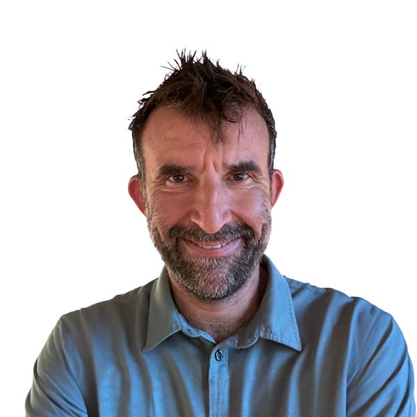 Profile image of Oliver Bayley, a White man with short brown hair and dark stubble.
