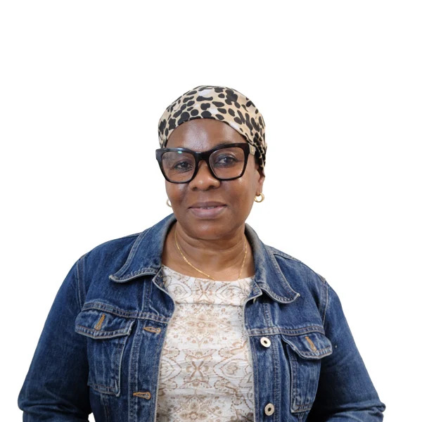 Headshot of Felicia Baio, a Liberian woman with her dark hair in a headscarf wearing cat-eye glasses and a jean jacket.